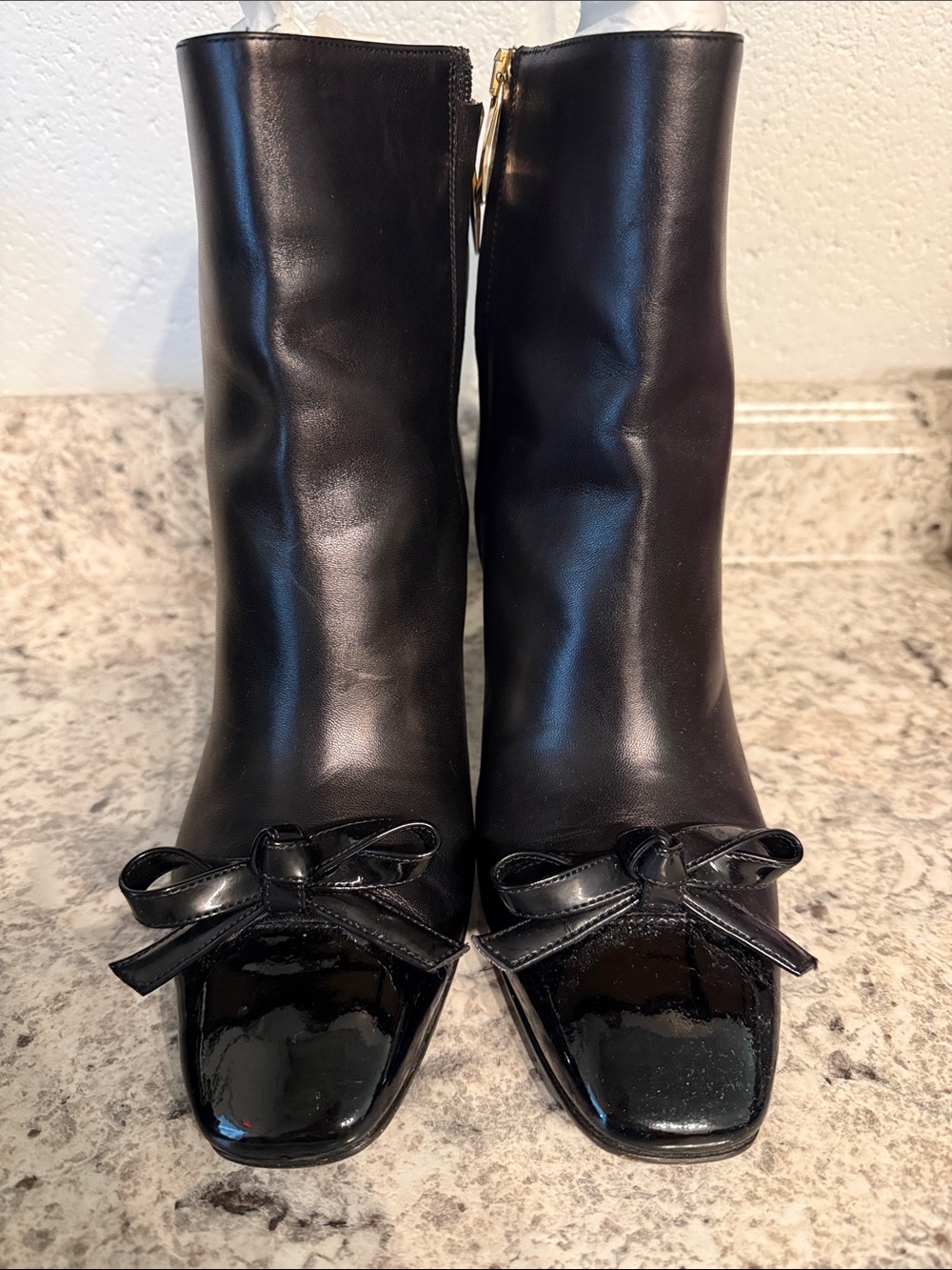 Kate spade black boot with patent toe and bow. Worn once